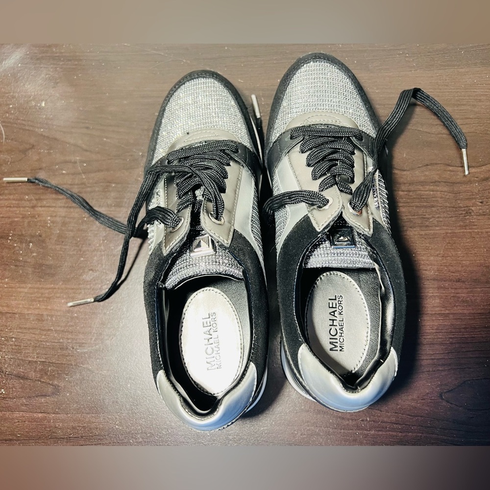 From Michael Kors, the Georgie Glitter Leather Wedge Trainer Wedge Heel Sneaker